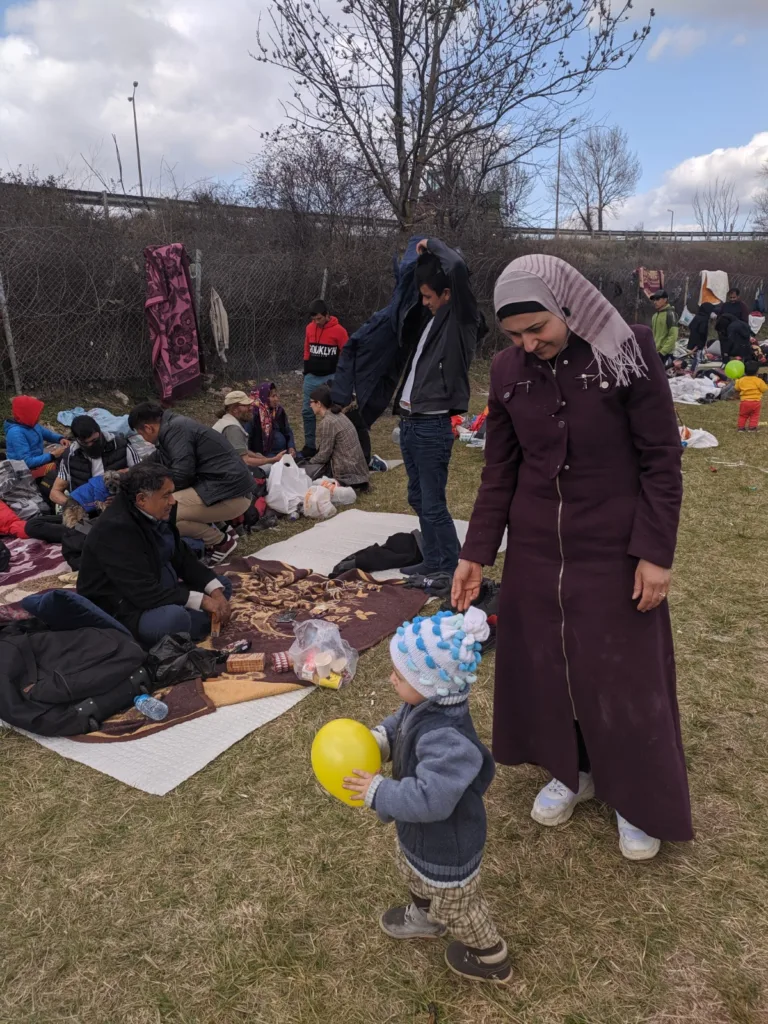 Migrant families sharing a meal